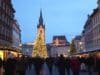 Festive Christmas market in Prague, showcasing holiday lights, decorations, and local crafts in a charming atmosphere.