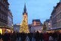 Festive Christmas market in Prague, showcasing holiday lights, decorations, and local crafts in a charming atmosphere.