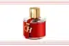 A striking red perfume bottle featuring gold lettering, labeled "CH Fragrances."