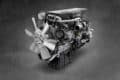 DD15 engine displayed on a gray background, showcasing its sleek design and advanced features.