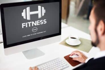 Computer screen displaying a fitness program titled "Logi Fit" with workout visuals and tracking features.