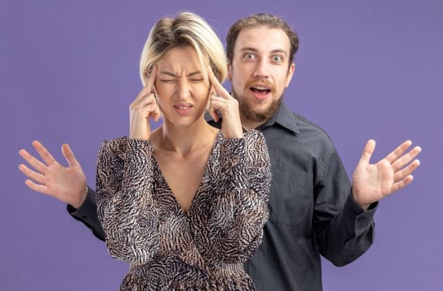 A man and woman stand facing each other, discussing ways adults cope with stress in surprising ways.
