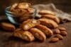 Delicious бишкоти ди прато with visible almonds, elegantly placed on a wooden table.