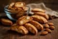 Delicious бишкоти ди прато with visible almonds, elegantly placed on a wooden table.
