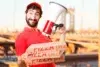 A man with a pizza box and a megaphone stands, advertising "Pizza Cerca de Mi."