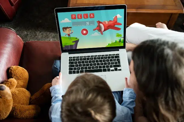 Children playing educational games on Sheppard Software platform.