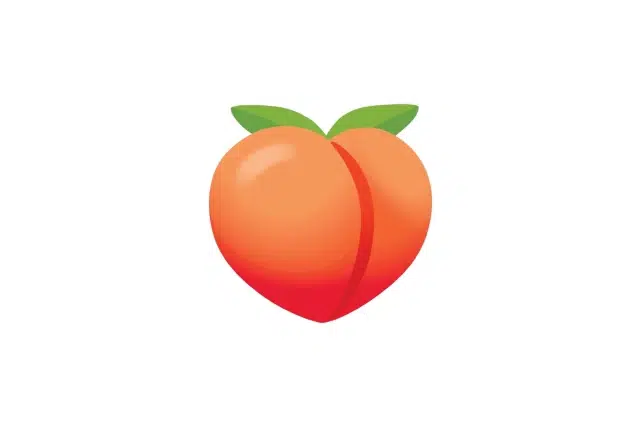 A stylized, colorful peach with a heart shape and two green leaves on top against a plain white background.