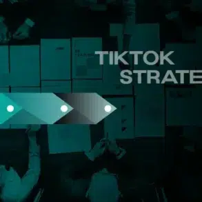 Aerial view of a team brainstorming with documents labeled 'TikTok Strategy' spread across a dark table.