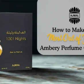 A gold and clear perfume bottle beside a sleek black box labeled "1001 Nights" by Ajmal, with tips on enhancing an ambery perfume collection.