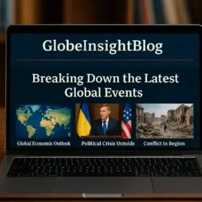 A laptop displays the GlobeInsightBlog homepage, featuring sections on global economic outlook, political crises, and regional conflict.