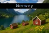 Scenic view of a tranquil Norwegian fjord surrounded by green mountains, featuring charming red cottages and colorful wildflowers.