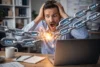 A man looking shocked, holding his head, as digital chains labeled "link" explode from a laptop. The scene conveys stress and chaos in a modern office.