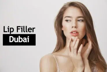 Young woman with long hair, touching her face, looking thoughtful. Text on the left reads "Lip Filler Dubai." Neutral background enhances focus.