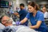 nurse tech emergency department taking vital signs in an ER room