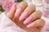 Pink French Tip Nails with a sheer blush base and glossy soft pink tips in 25 trendy design variations.