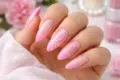 Pink French Tip Nails with a sheer blush base and glossy soft pink tips in 25 trendy design variations.