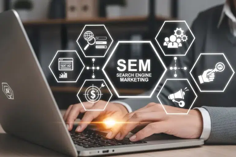 A person types on a laptop with floating hexagonal icons representing SEM concepts, like analytics and advertising. The mood is professional and focused.