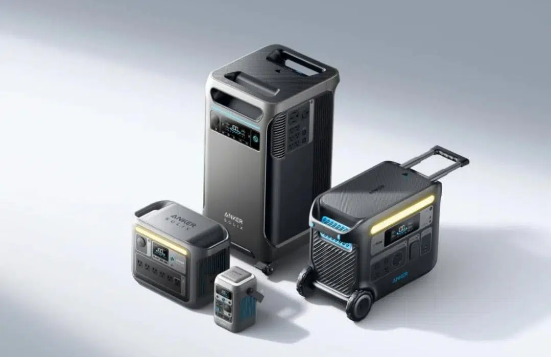 Four portable power stations of varying sizes are displayed on a light background. They feature digital screens and robust handles, conveying functionality.