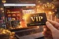 Hand holding a VIP card in front of a laptop displaying a casino website with slot reel and VIP benefits. Luxurious, exclusive vibe with gold coins.