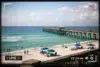 Navarre Beach Cam live view showing surf, sky, and beach conditions today