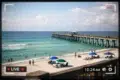 Navarre Beach Cam live view showing surf, sky, and beach conditions today