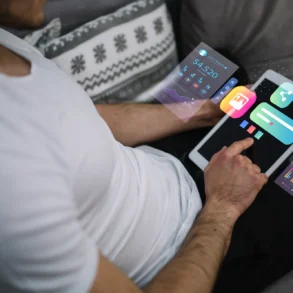 A person in a white shirt uses a tablet displaying holographic financial graphs and app icons, conveying a futuristic and tech-savvy atmosphere.