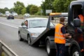 Tow Truck Near Me roadside assistance helping a broken down car on the side of the road