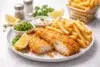 рыба и картофель фри served as classic fish and chips with crispy battered fish, thick cut chips, and malt vinegar