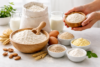 All Purpose Flour UK comparison with plain flour, strong flour, and baking substitutes on a kitchen counter