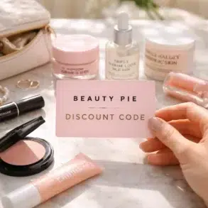 A collection of luxury Beauty Pie skincare and makeup products on a vanity, representing a membership haul saved by using a Beauty Pie discount code.