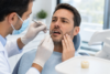 Chipped Tooth Crown being examined by a dentist during a repair consultation