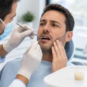 Chipped Tooth Crown being examined by a dentist during a repair consultation