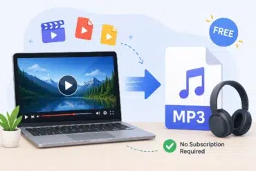 Laptop displaying a video with a play button next to icons of video files, an arrow pointing to an MP3 symbol, and headphones. Text reads "Free" and "No Subscription Required." A small plant is beside the laptop.