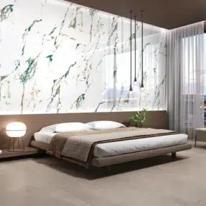 Modern bedroom with a floating bed, marble accent wall, and floor-to-ceiling windows showing a cityscape at dusk. Elegant, serene atmosphere.