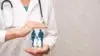 A doctor with a stethoscope holds an illustrated family silhouette, symbolizing healthcare. The image conveys protection and care in a soft, reassuring tone.