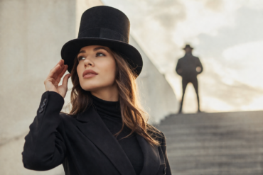 Higher Hat fashion trend featuring a bold, structured tall-crown hat styled with a modern outfit