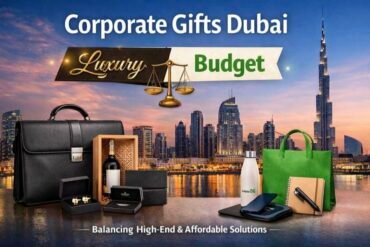 Corporate gifts ad featuring a Dubai skyline at sunset. Includes luxury items like a leather briefcase and wine, and budget items like a tote bag and notebook.