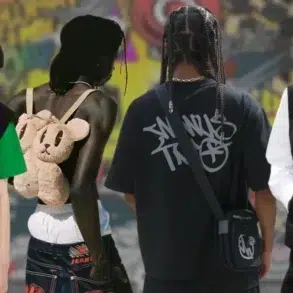 Streetwear fashion scene with four diverse models in edgy outfits. Features bunny ear hood, teddy bear backpack, and graffiti backdrop, conveying urban style.