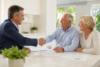 Own a Senior Business owner meeting an older client and family while discussing trusted senior services