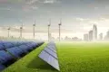 A field of solar panels and wind turbines stand on a grassy plain, with a city skyline in the background under a bright, partly cloudy sky.