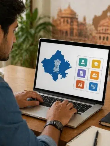 Man working on a laptop displaying a map with icons, suggesting governmental or educational content. Background shows a potted plant and notebooks.