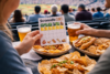 Scrandle daily stadium food comparison game showing two football matchday meals side by side