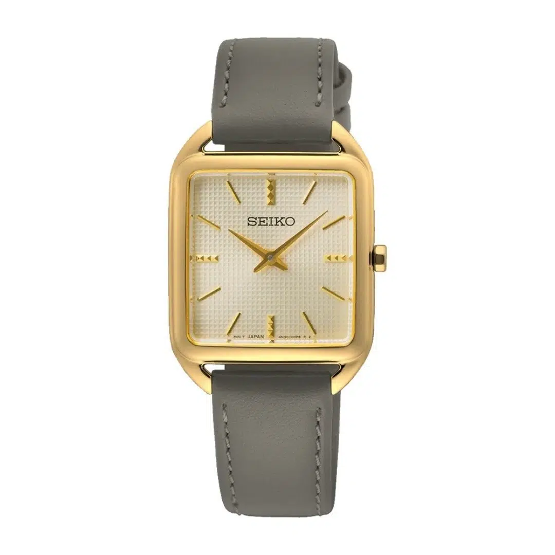 Rectangular Seiko watch with a gold case, textured cream dial, and gold hour markers. It features a gray leather strap, exuding a classic elegance.