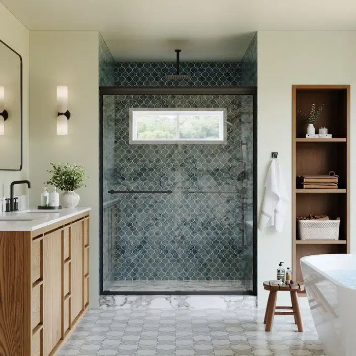Modern bathroom with glass shower, patterned tiles, wooden vanity, freestanding tub, and open shelving with towels and decor.