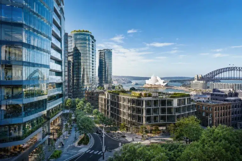 A vibrant cityscape featuring modern glass buildings, a lush rooftop garden, Sydney Opera House, and the Harbour Bridge under a clear blue sky.