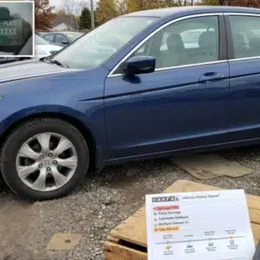 A blue sedan parked in a lot with laptops displaying a VIN and vehicle history report. Overcast sky and autumn trees set a somber, investigative tone.