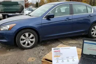 A blue sedan parked in a lot with laptops displaying a VIN and vehicle history report. Overcast sky and autumn trees set a somber, investigative tone.