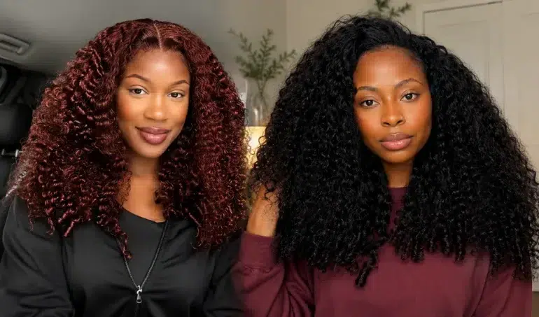 Two women with voluminous curly hair, one with dark red curls and the other with black curls, indoors with a neutral background.