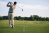 Golfer practicing at a Driving Range to improve swing accuracy and distance control