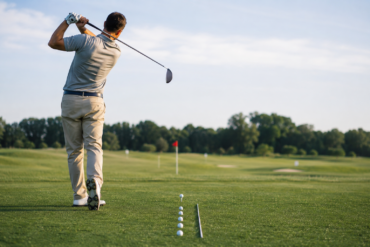 Golfer practicing at a Driving Range to improve swing accuracy and distance control